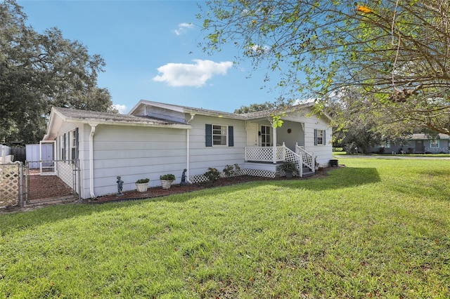 ranch-style home featuring a front yard