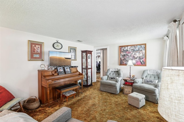 carpeted living room with a textured ceiling