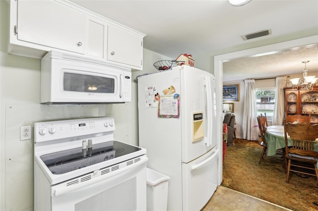 kitchen with light colored carpet, a chandelier, white appliances, and white cabinetry