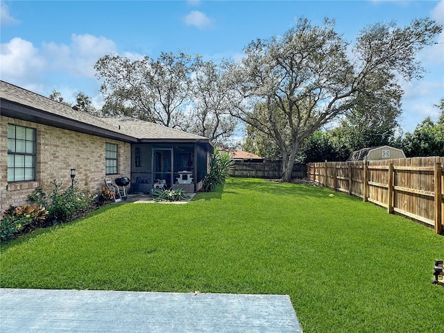 view of yard with a sunroom