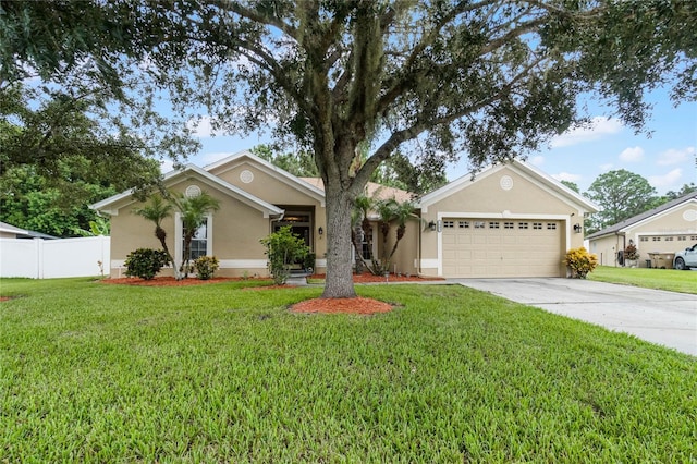 single story home with a garage and a front lawn