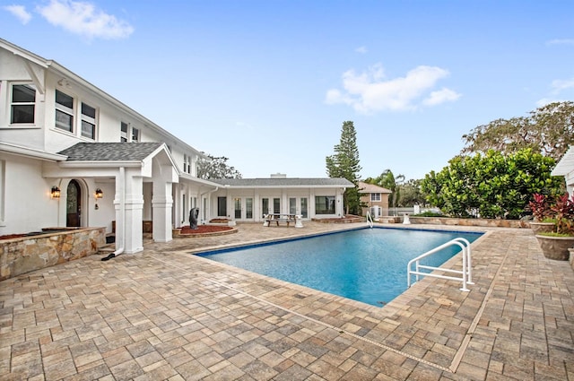 view of swimming pool with a patio