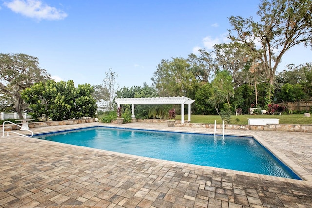 view of pool with a pergola and a patio area