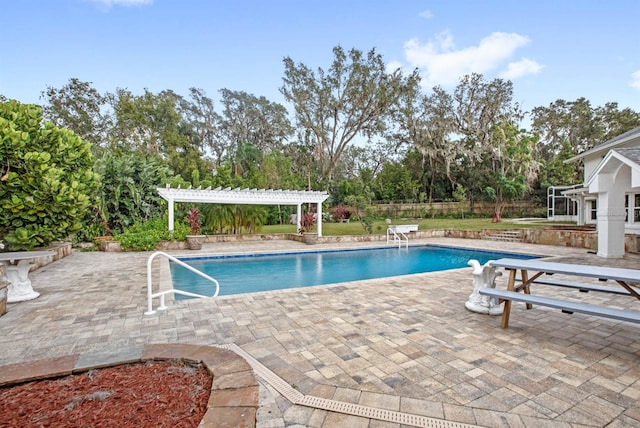 view of swimming pool with a patio and a pergola