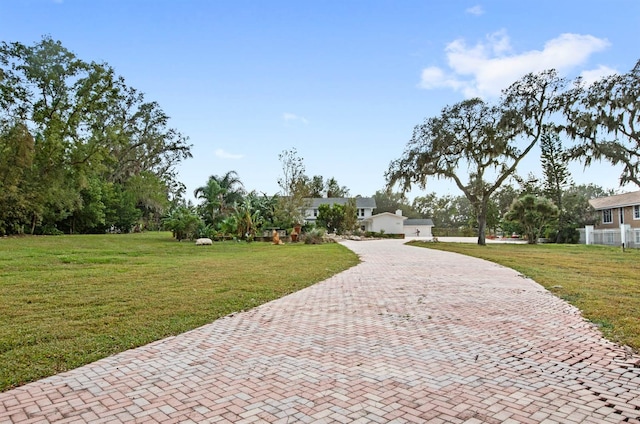 surrounding community featuring a yard