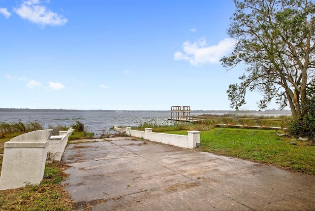 view of patio with a water view