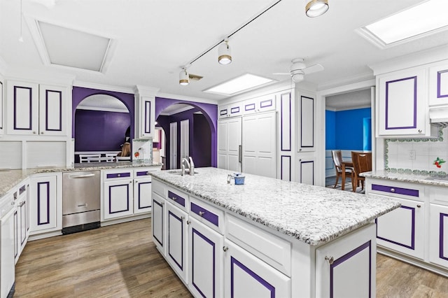 kitchen featuring white cabinetry, dark wood-type flooring, and a kitchen island