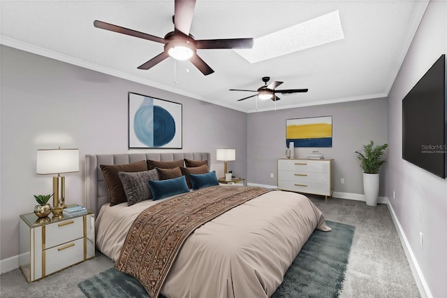 carpeted bedroom with ceiling fan, a skylight, and ornamental molding