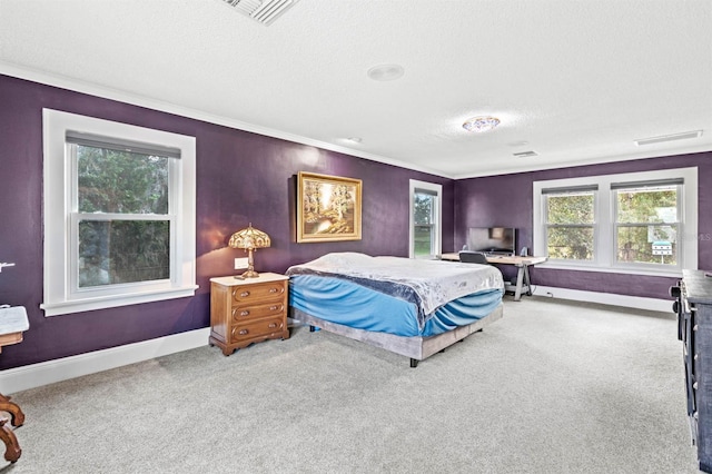 bedroom featuring carpet, a textured ceiling, and crown molding