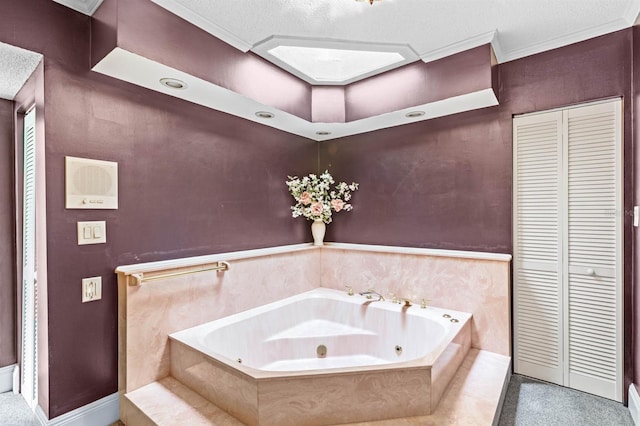 bathroom featuring a relaxing tiled tub, a textured ceiling, and crown molding