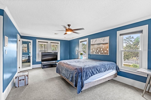 bedroom with multiple windows, a textured ceiling, and ceiling fan