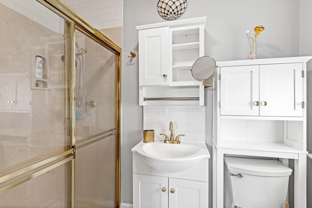 bathroom with walk in shower, decorative backsplash, vanity, and toilet