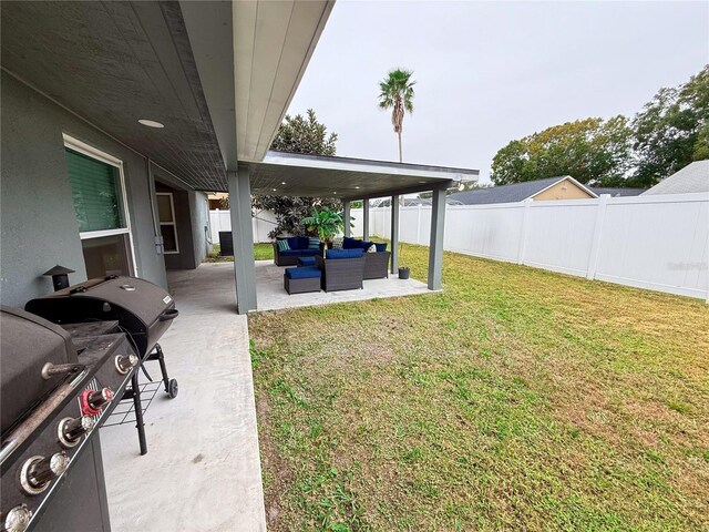 view of yard with outdoor lounge area and a patio area