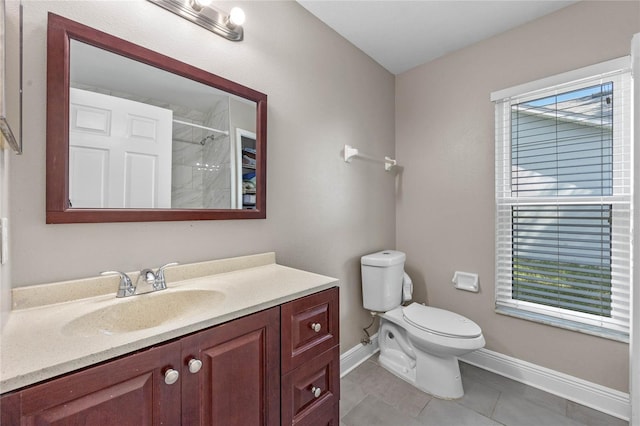 bathroom with tile patterned flooring, a shower, vanity, and toilet