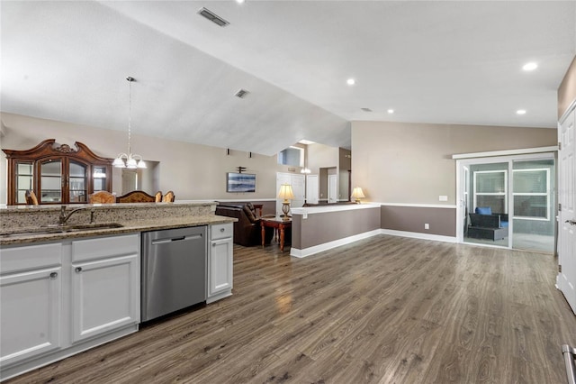 kitchen with sink, white cabinetry, hanging light fixtures, vaulted ceiling, and stainless steel dishwasher