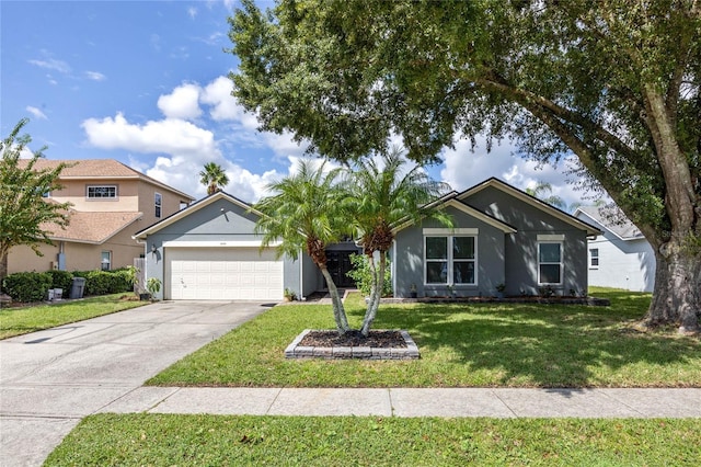 view of front of home featuring a garage and a front lawn