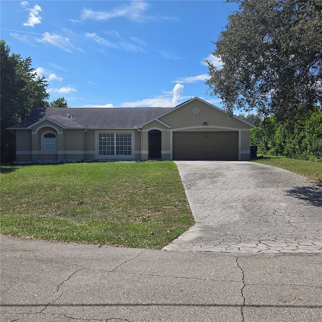 single story home with a front yard and a garage