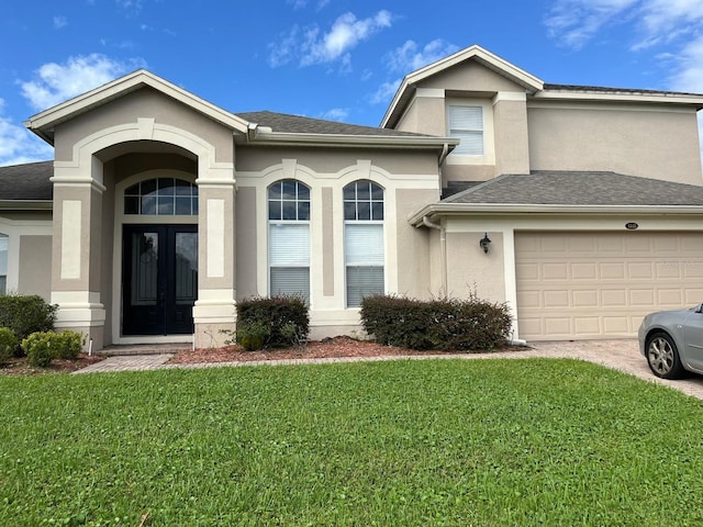 view of front facade featuring a front yard and a garage