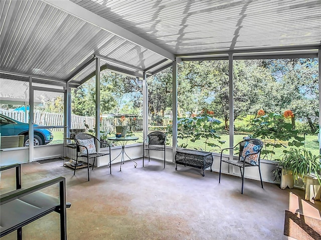 sunroom / solarium with lofted ceiling and plenty of natural light