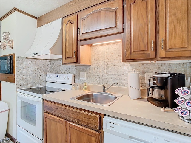 kitchen with white appliances, sink, extractor fan, and tasteful backsplash