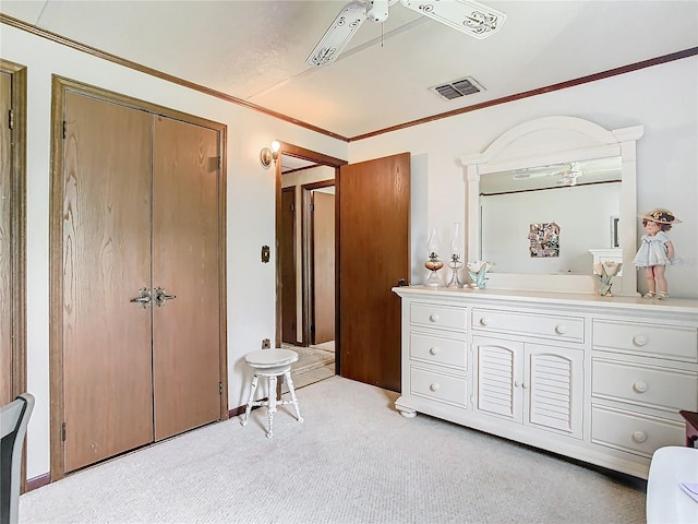 bathroom featuring ceiling fan, vanity, and ornamental molding