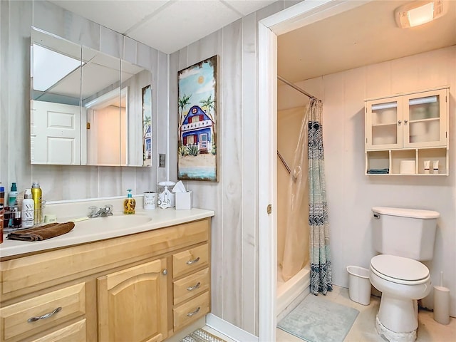 full bathroom with shower / tub combo, tile patterned flooring, vanity, and toilet