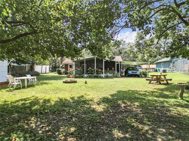 view of yard with a sunroom