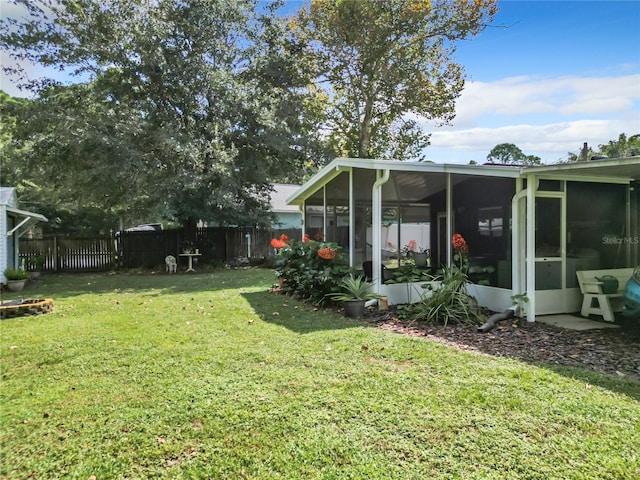 view of yard featuring a sunroom