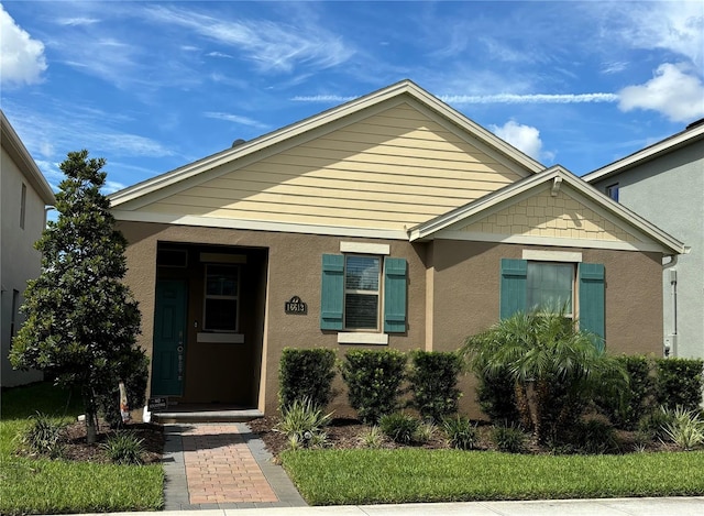 16613 Point Rock Dr, Winter Garden, FL 34787 - view of front of property featuring stucco siding