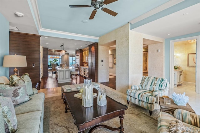 living room with ceiling fan and hardwood / wood-style floors