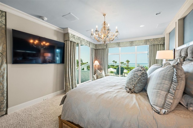 carpeted bedroom featuring access to outside, a notable chandelier, and ornamental molding