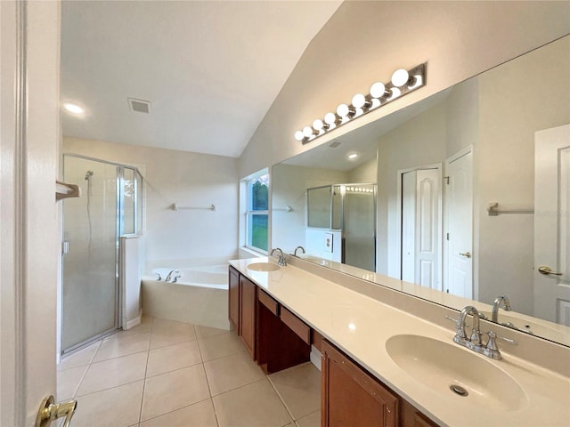 bathroom featuring vanity, shower with separate bathtub, tile patterned flooring, and vaulted ceiling