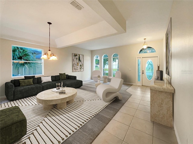 living room featuring light tile patterned flooring and a chandelier