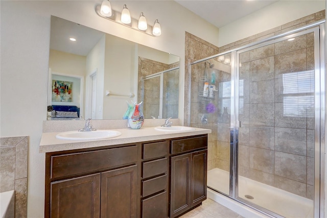 bathroom featuring walk in shower and vanity