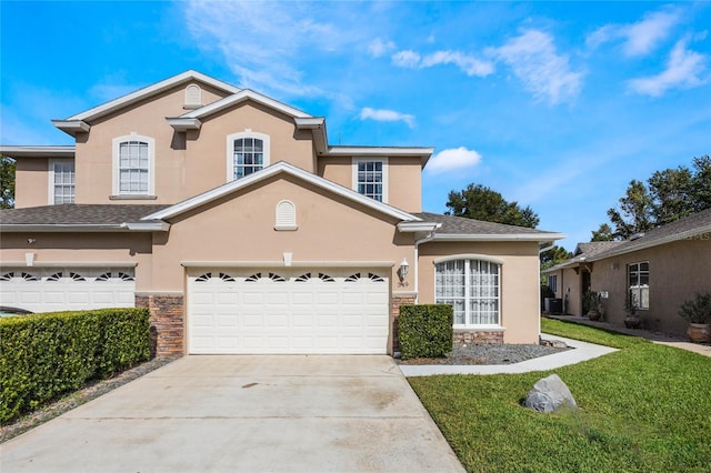 view of front of home featuring a garage, stone siding, concrete driveway, and stucco siding