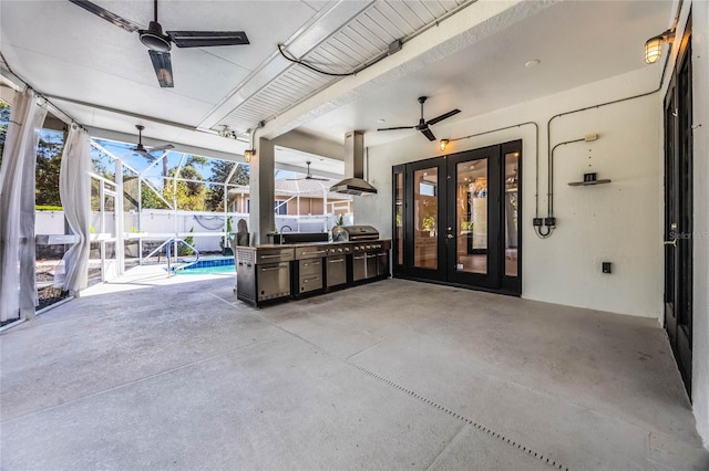 view of patio featuring french doors, ceiling fan, and a lanai