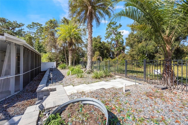 view of yard featuring a sunroom