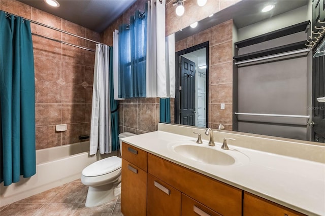 full bath featuring toilet, vanity, tile walls, tile patterned floors, and shower / tub combo with curtain