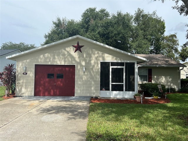 ranch-style home with a garage and a front lawn