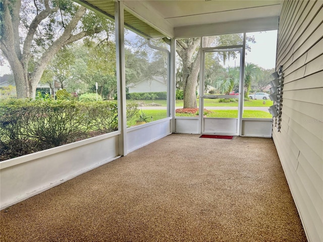 unfurnished sunroom featuring a wealth of natural light