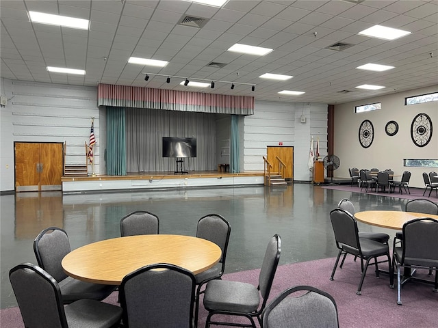 dining area featuring a paneled ceiling