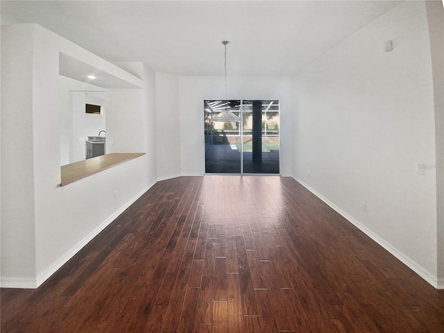 interior space featuring dark hardwood / wood-style floors and a chandelier