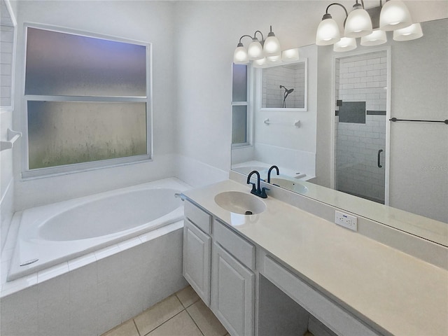 bathroom featuring tile patterned flooring, vanity, plus walk in shower, and a notable chandelier