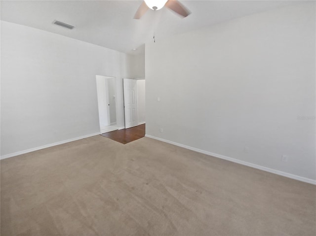 empty room featuring light carpet and ceiling fan