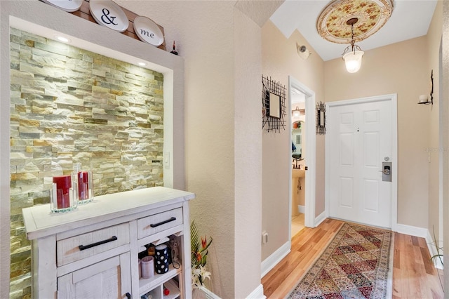 foyer entrance with light hardwood / wood-style flooring