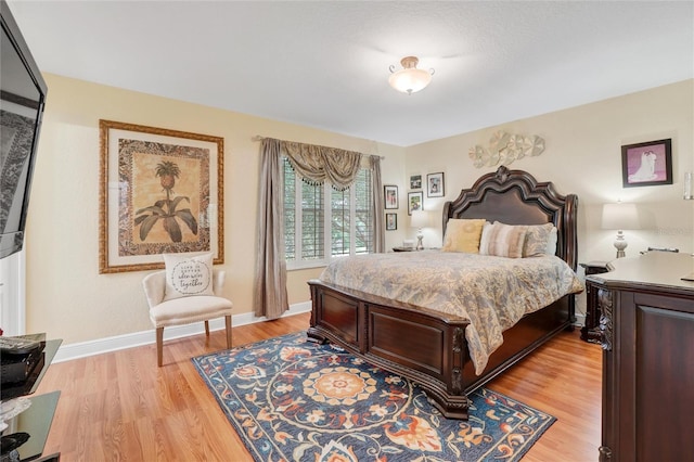 bedroom featuring light hardwood / wood-style floors