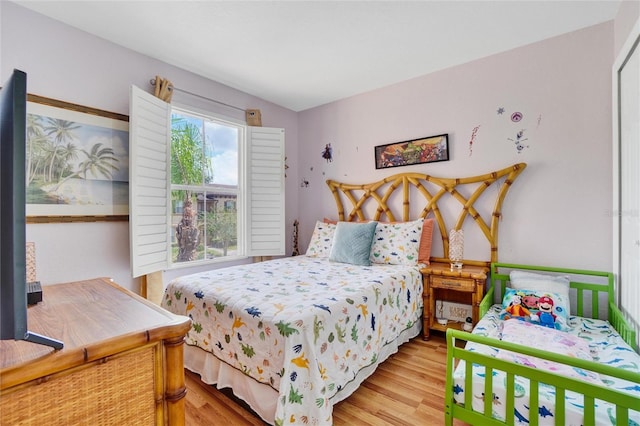 bedroom with light hardwood / wood-style floors