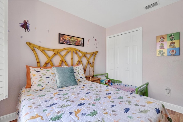 bedroom featuring a closet and hardwood / wood-style flooring