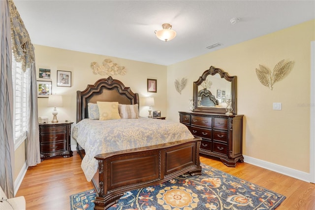 bedroom featuring light hardwood / wood-style floors