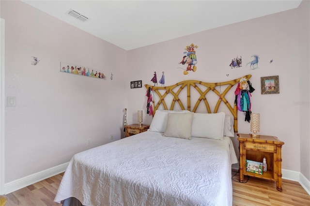 bedroom featuring hardwood / wood-style flooring